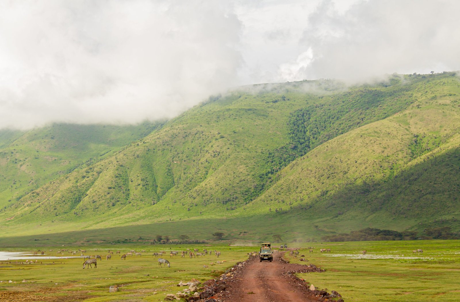 Safari jeep in Ngorongoro landscape for private safari from Arusha